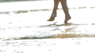 At The Beach A Cunning Lady Strips Off To Tease