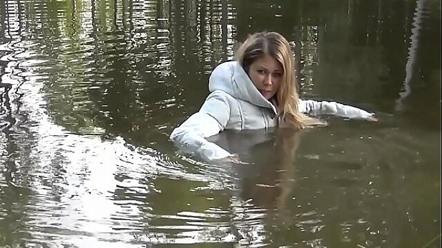 White Winter Coat Gets Soaked In Sexy Wetlook