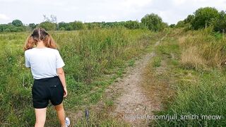 Bottomless Girl With Pigtails Walks Along A Country Road