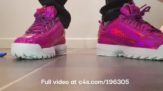 Girl Crushing Balloons With Fila Disruptor Sneakers