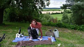 Redheaded Woman Is Having A Picnic For Herself Where She Is Riding On A Dildo